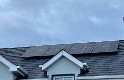 Four solar panels on house roof . About 1 kW power